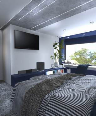 Sypialnia z dużym łóżkiem kontynentalnym oraz z miejscem przy oknie przeznaczone do wypoczynku
