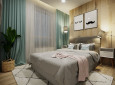 Sypialnia z szarym, tapicerowanym łóżkiem kontynentalnym oraz designerskimi szafkami nocnymi