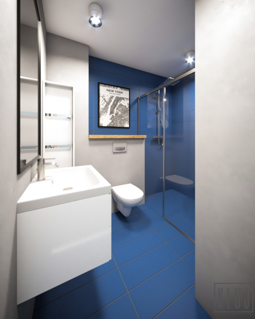Projekt łazienki z prysznicem oraz z niebieskimi płytkami na podłodze i ścianie