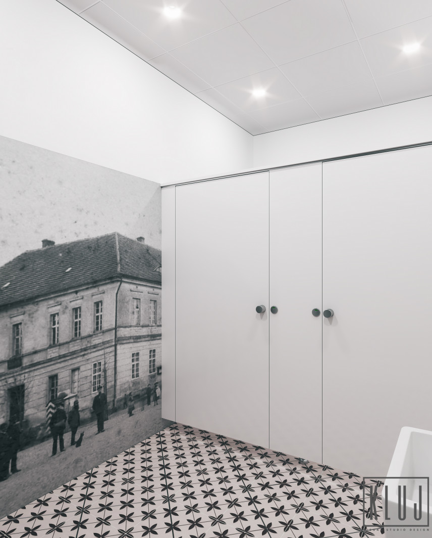 Łazienka z czarno-białą tapetą na ścianie