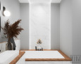 Projekt łazienki z białym gresem na ścianie oraz z wanną w zabudowie