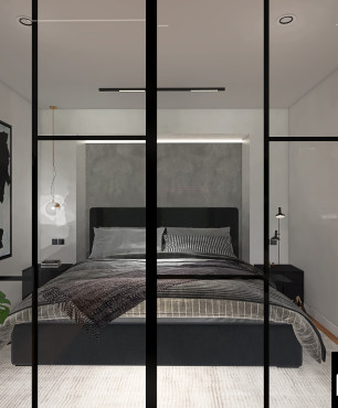 Sypialnia z dużym, tapicerowanym, czarnym łóżkiem kontynentalnym