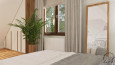Sypialnia z stylu klasycznym na poddaszu z dużą zieloną palmą