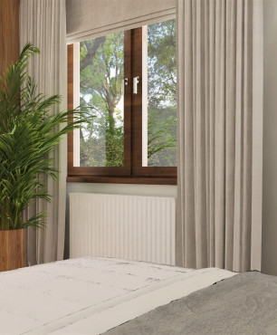 Sypialnia z stylu klasycznym na poddaszu z dużą zieloną palmą