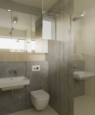 Mała, klasyczna łazienka z prysznicem oraz szarymi płytkami na ścianie