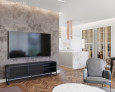 Salon z telewizorem zamontowanym do ściany z ozdobnym betonem architektonicznym