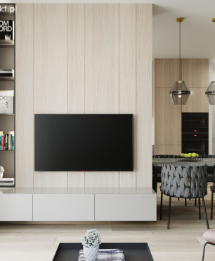 Salon z z drewnem na ścianie oraz z telewizorem montowanym do ściany