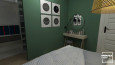 Sypialnia z kolorem butelkowej zieleni na ścianie oraz z toaletką