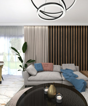 Salon i jadalnia z drewnianym lamelem oraz z betonem architektonicznym na ścianie
