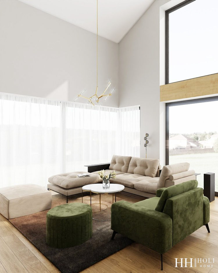 Słoneczny salon z dużymi oknami oraz z tapicerowanym wypoczynkiem