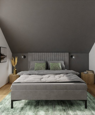 Strefa relaksu na poddaszu z dużym łóżkiem kantonalnym