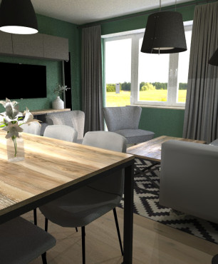 Jadalnia i salon z jasnymi panelami na podłodze oraz zielonym kolorem ścian