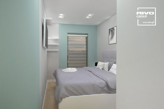 Mała sypialnia z łóżkiem kontynentalnym oraz z turkusowym kolorem ścian