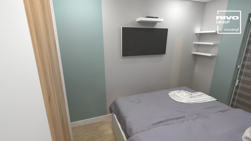 Klimatyczna, nowoczesna sypialnia z łóżkiem kontynentalnym oraz telewizorem na ścianie