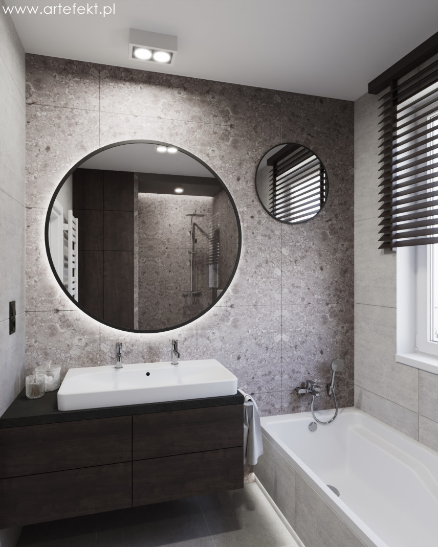Projekt łazienki z okrągłym lustrem w stylu loft