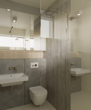 Łazienka z prysznicem oraz szarymi płytkami na ścianie