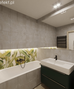 Łazienka z wanną akrylową oraz ze wzorem botanicznym na ścianie