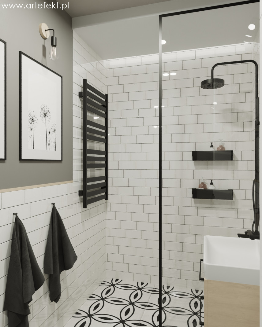 Łazienka z białymi płytkami na ścianie oraz prysznicem walk-in