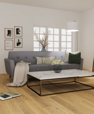 Przestrzenny projekt salonu z szarą sofą