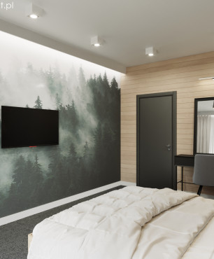 Mała sypialnia z tapetą i telewizorem na ścianie