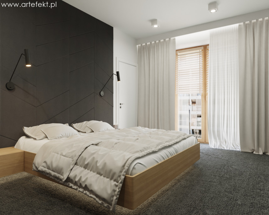 Sypialnia z czarnymi panelami na ścianie oraz z drewnianym łóżkiem kontynentalnym