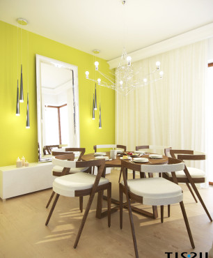 Jadalnia z zielonym kolorem ścian oraz drewnianym stołem