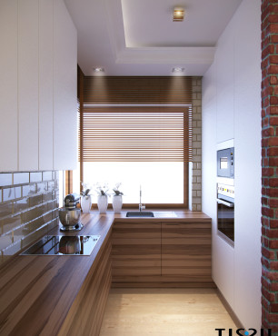 Mała kuchnia narożna z oknem nad laminowanym, drewnianym blatem