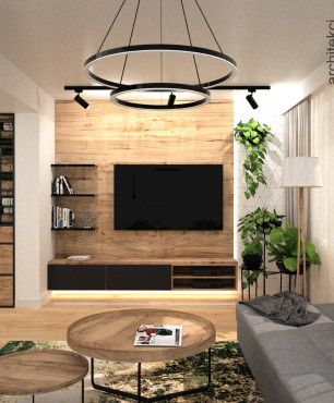 Salon ze stylową lampą wiszącą oraz z drewnem na ścianie