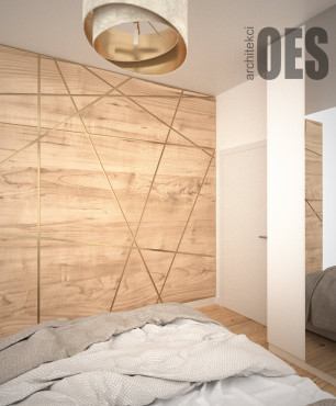 Sypialnia z drewnem na ścianie ze złotymi wstawkami
