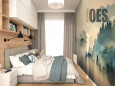 Projekt sypialni z tapetą z motywem leśnym na ścianie