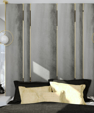Sypialnia z szarą tapicerowaną ścianą ze złotymi wstawkami