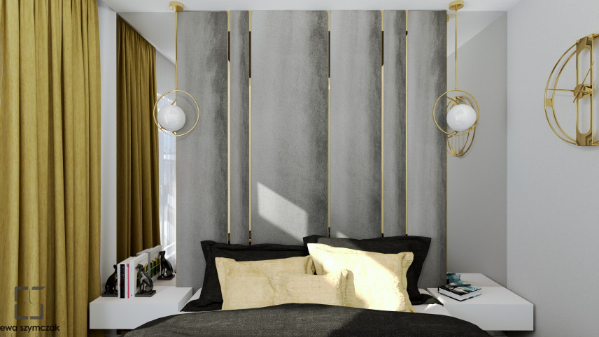 Sypialnia z szarą tapicerowaną ścianą ze złotymi wstawkami