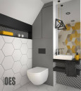 Łazienka ze skosem na suficie z płytkami ułożonymi na wzór heksagonalny