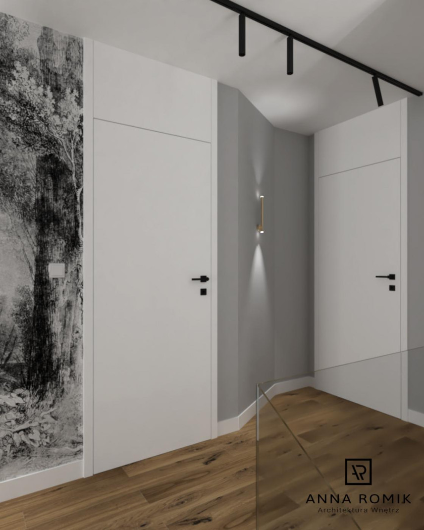 Korytarz z szarym kolorem ścian oraz czarno-białą tapetą