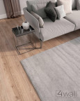 Klasyczny salon z beżowym dywanem i materiałową sofą
