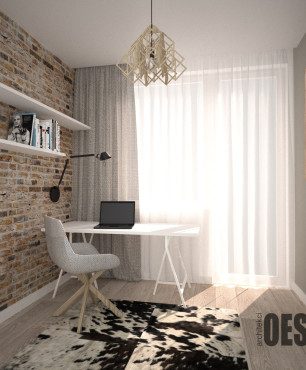 Biuro domowe z cegłą na ścianie oraz białą półką montowaną do ściany