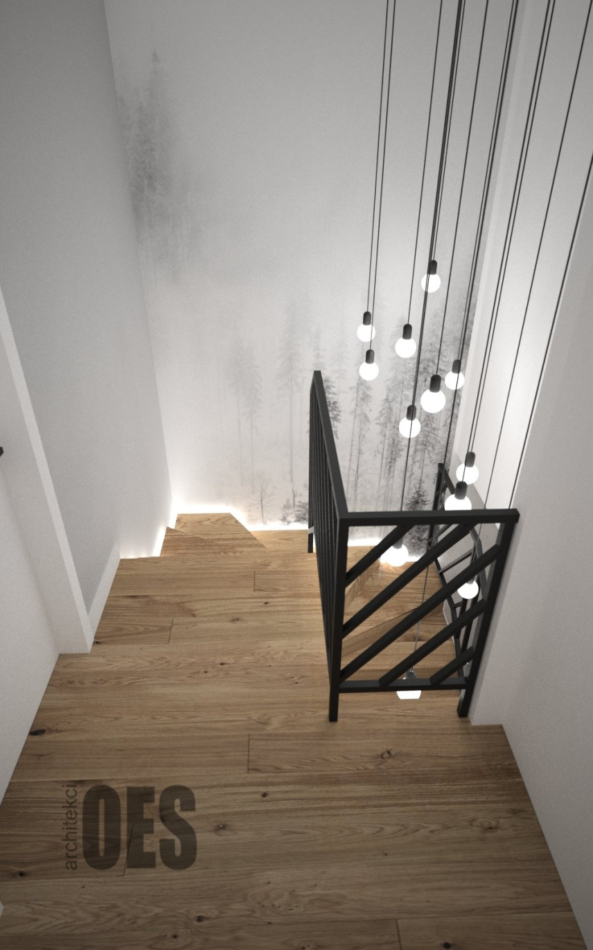 Klatka schodowa ze schodami z imitacją drewnianych płytek na podłodze