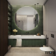 Łazienka z zielonymi płytkami na ścianie z dużym, okrągłym lustrem