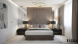 Sypialnia z tapicerowaną ścianą w kolorze beżowym oraz dużym łóżkiem tapicerowanym