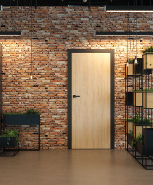 Przedpokój w stylu loft z cegłą na ścianie oraz drewnianymi drzwiami firmy PORTA