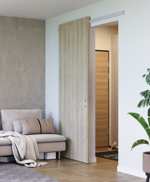 Drewniane drzwi przesuwne w salonie z betonem ozdobnym na ścianie