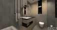 Łazienka w stylu industrialnym z szarymi płytkami na ścianie i podłodze