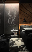 Sypialnia w ciemnych barwach z betonem ozdobom na ścianie
