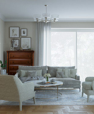 Klasyczny salon z tapicerowaną sofą oraz dwoma fotelami