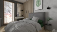 Sypialnia z tapicerowanym, szarym łóżkiem kontynentalnym