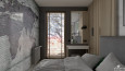 Mała sypialnia z tapetą z motywem mapy na ścianie