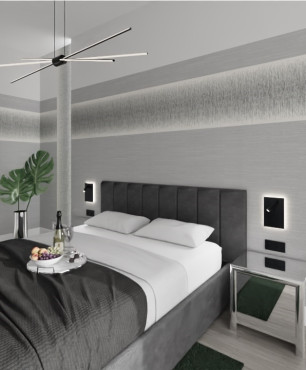 Klasyczna sypialnia z dużym łóżkiem kontynentalnym oraz szarym kolorem ścian