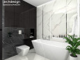 Projekt dużej łazienki z prostokątną wanną wolnostojącą, muszlą wiszącą oraz płytkami gresowymi w kolorze biało-czarnym