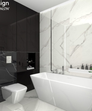Projekt dużej łazienki z prostokątną wanną wolnostojącą, muszlą wiszącą oraz płytkami gresowymi w kolorze biało-czarnym