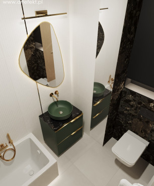 Nowoczesna łazienka z armaturą w kolorze złotym oraz zieloną umywalką nablatową